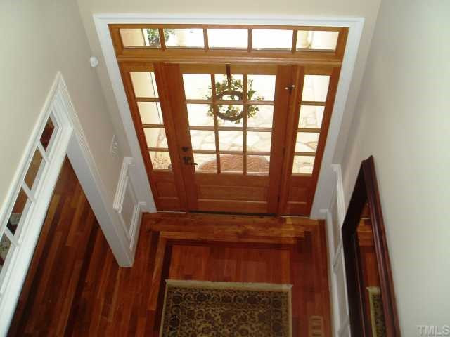 472 Waterville Street Raleigh, NC 27603 - Photo 4 of 7 Family room with floor to ceiling stone fireplace with gas logs.