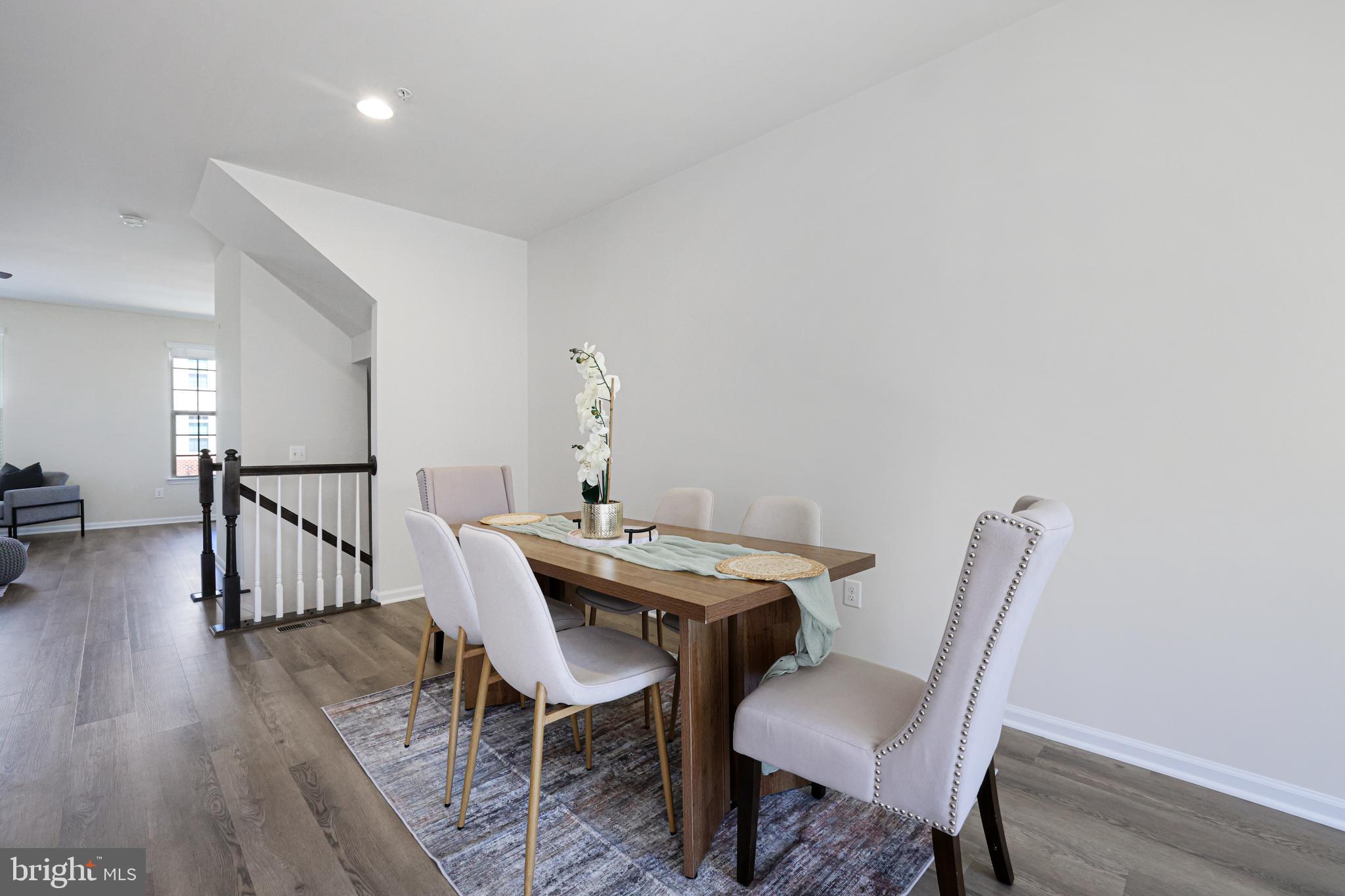 2741 Prospect Hill Drive Hanover, MD 21076 - Photo 16 of 64 a view of a dining room with furniture and wooden floor