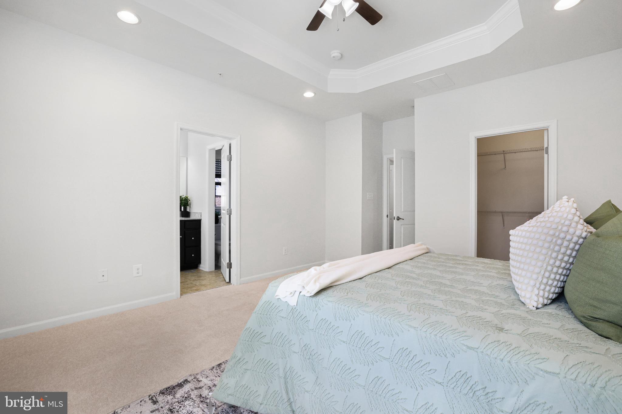 2741 Prospect Hill Drive Hanover, MD 21076 - Photo 33 of 64 a spacious bedroom with a bed and a chandelier