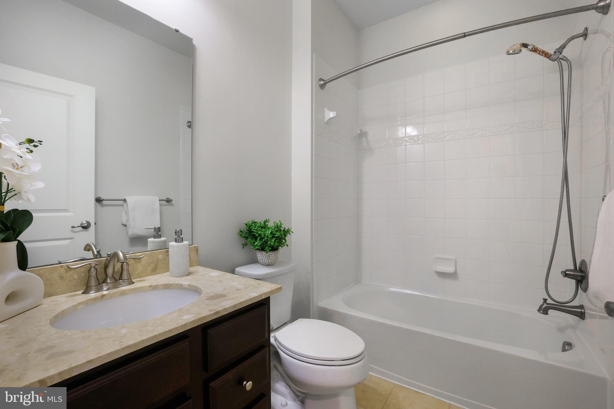 2741 Prospect Hill Drive Hanover, MD 21076 - Photo 35 of 64 a bathroom with a granite countertop sink toilet and shower