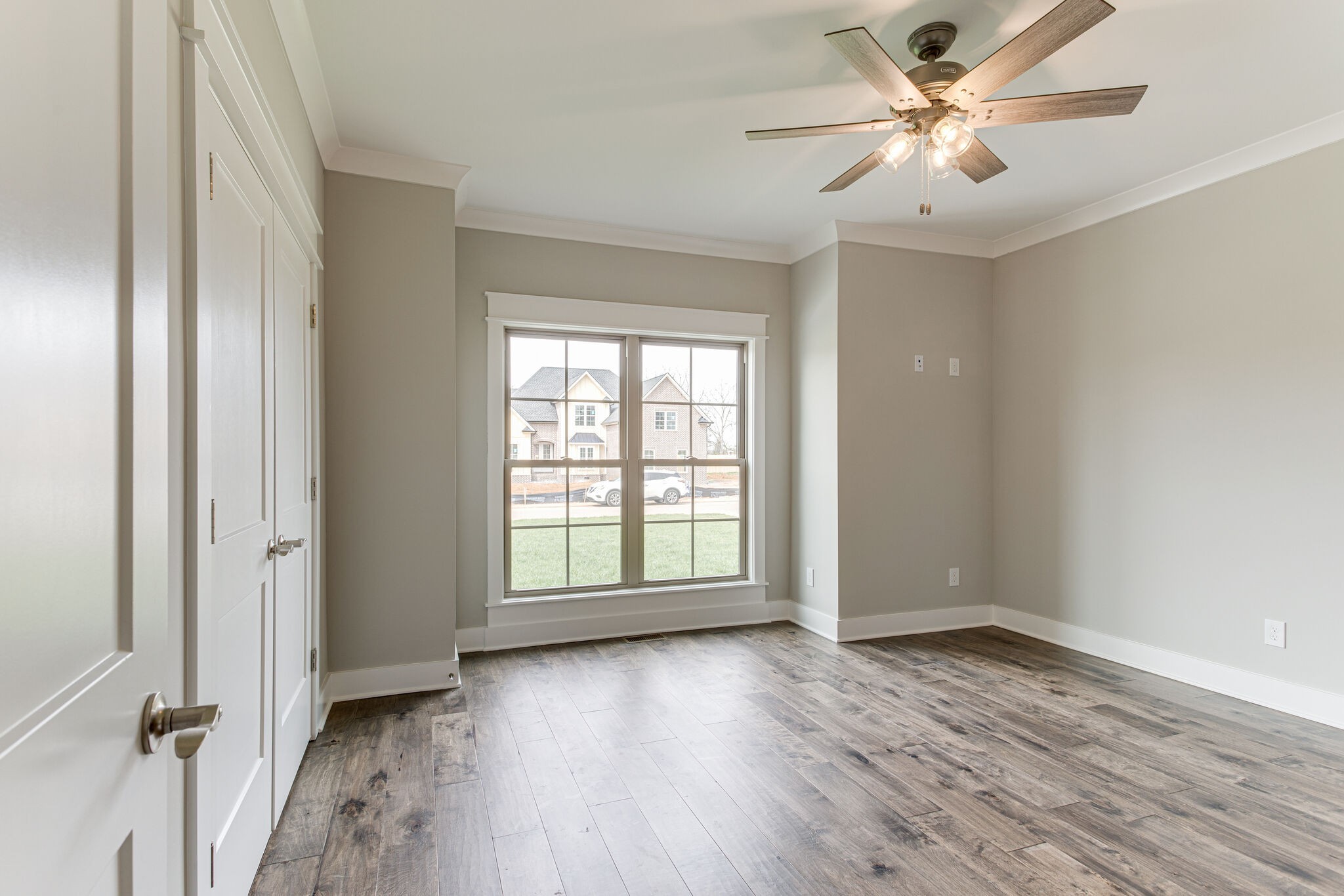 2617 Holly Spring Drive Murfreesboro, TN 37128 - Photo 15 of 50 an empty room with wooden floor fan and windows