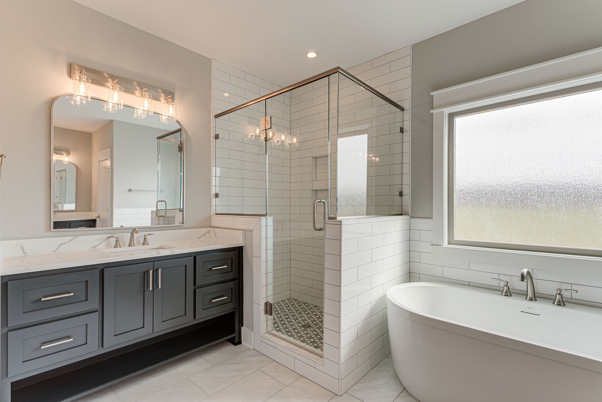 2617 Holly Spring Drive Murfreesboro, TN 37128 - Photo 20 of 50 a bathroom with a double vanity sink and a bathtub