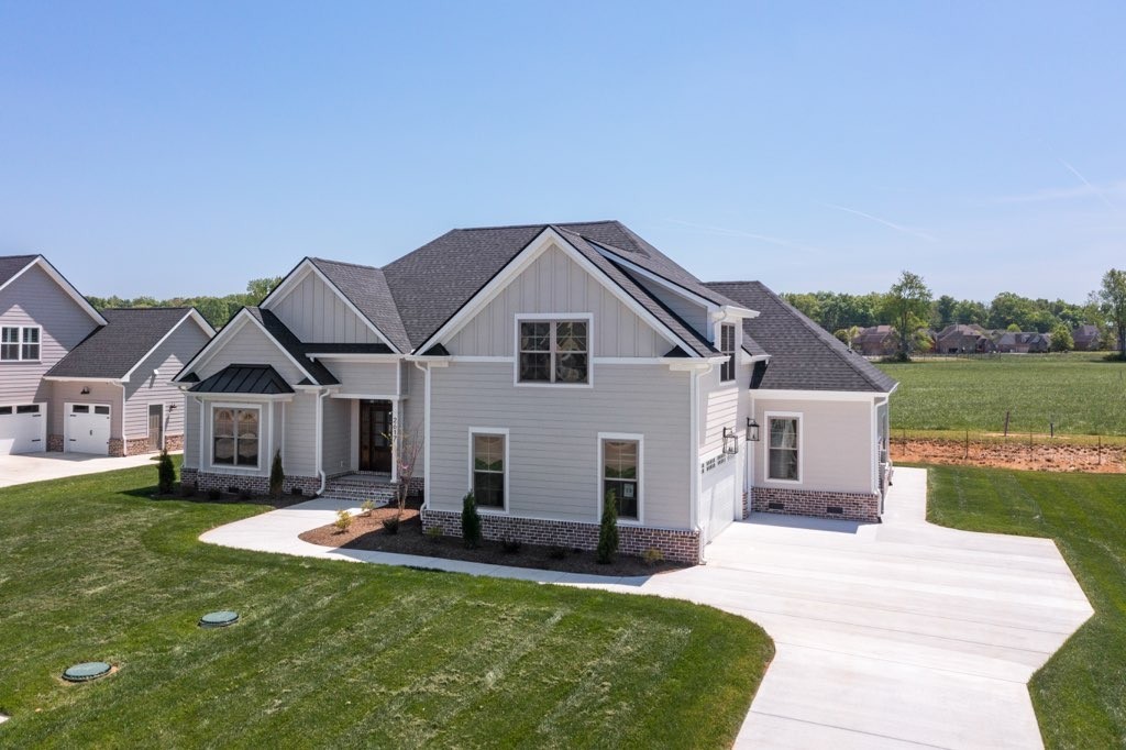 2617 Holly Spring Drive Murfreesboro, TN 37128 - Photo 2 of 50 a view of a house with a porch and a yard