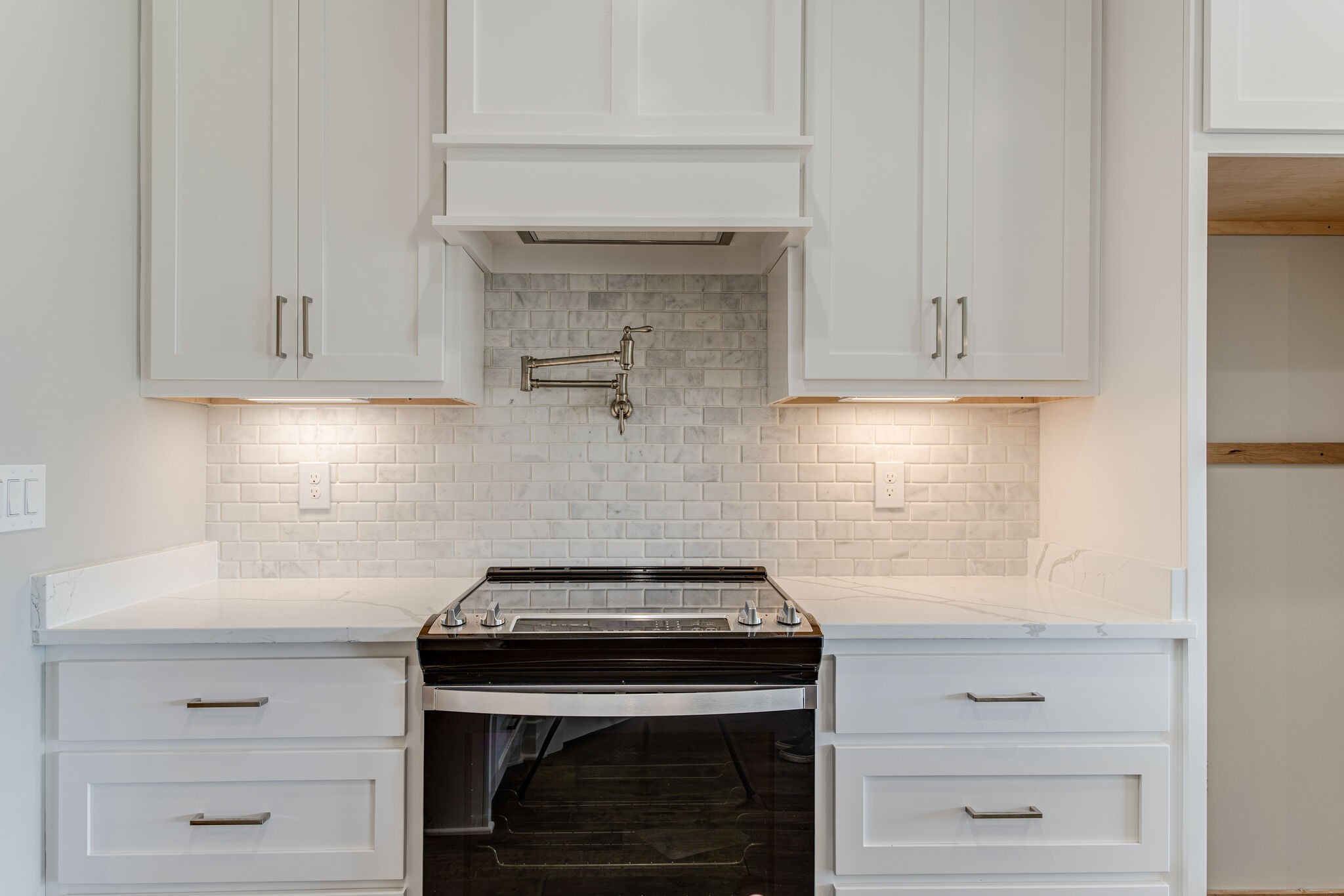 2617 Holly Spring Drive Murfreesboro, TN 37128 - Photo 27 of 50 a kitchen with granite countertop white cabinets and a stove