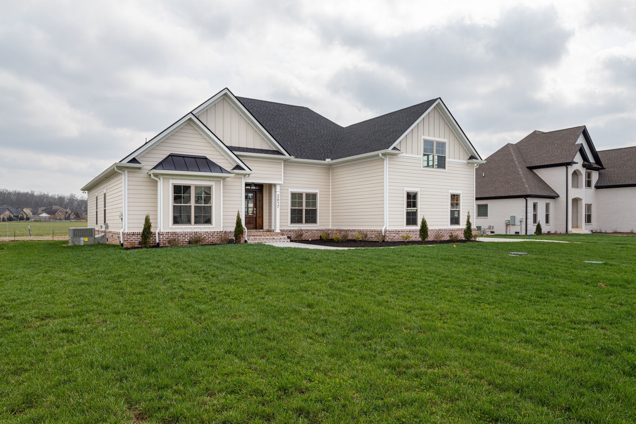 2617 Holly Spring Drive Murfreesboro, TN 37128 - Photo 3 of 50 a view of a yard in front of a house with green space