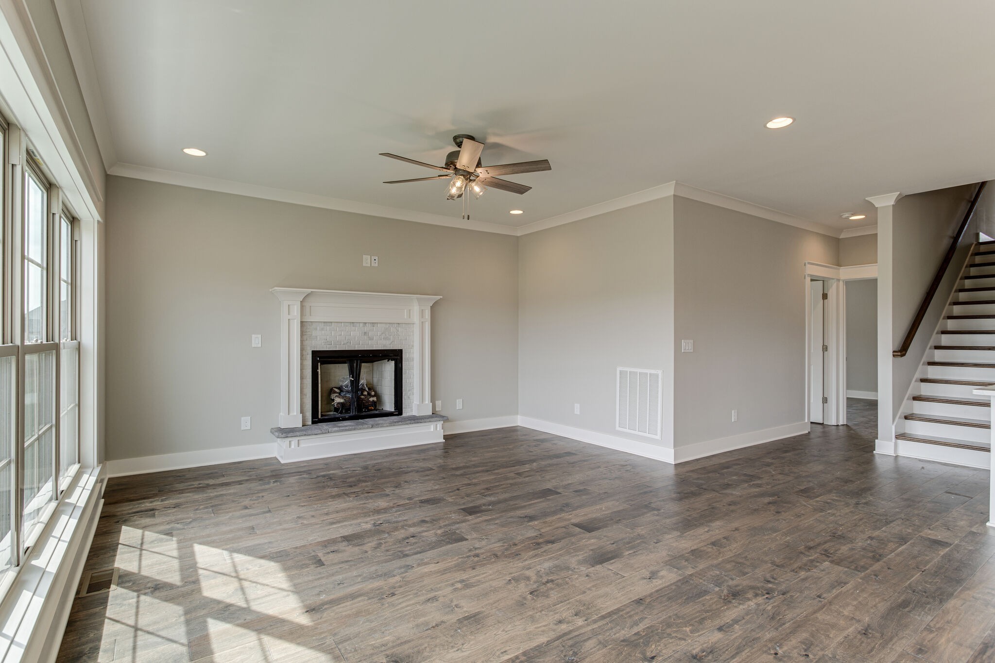 2617 Holly Spring Drive Murfreesboro, TN 37128 - Photo 32 of 50 an empty room with windows and fireplace