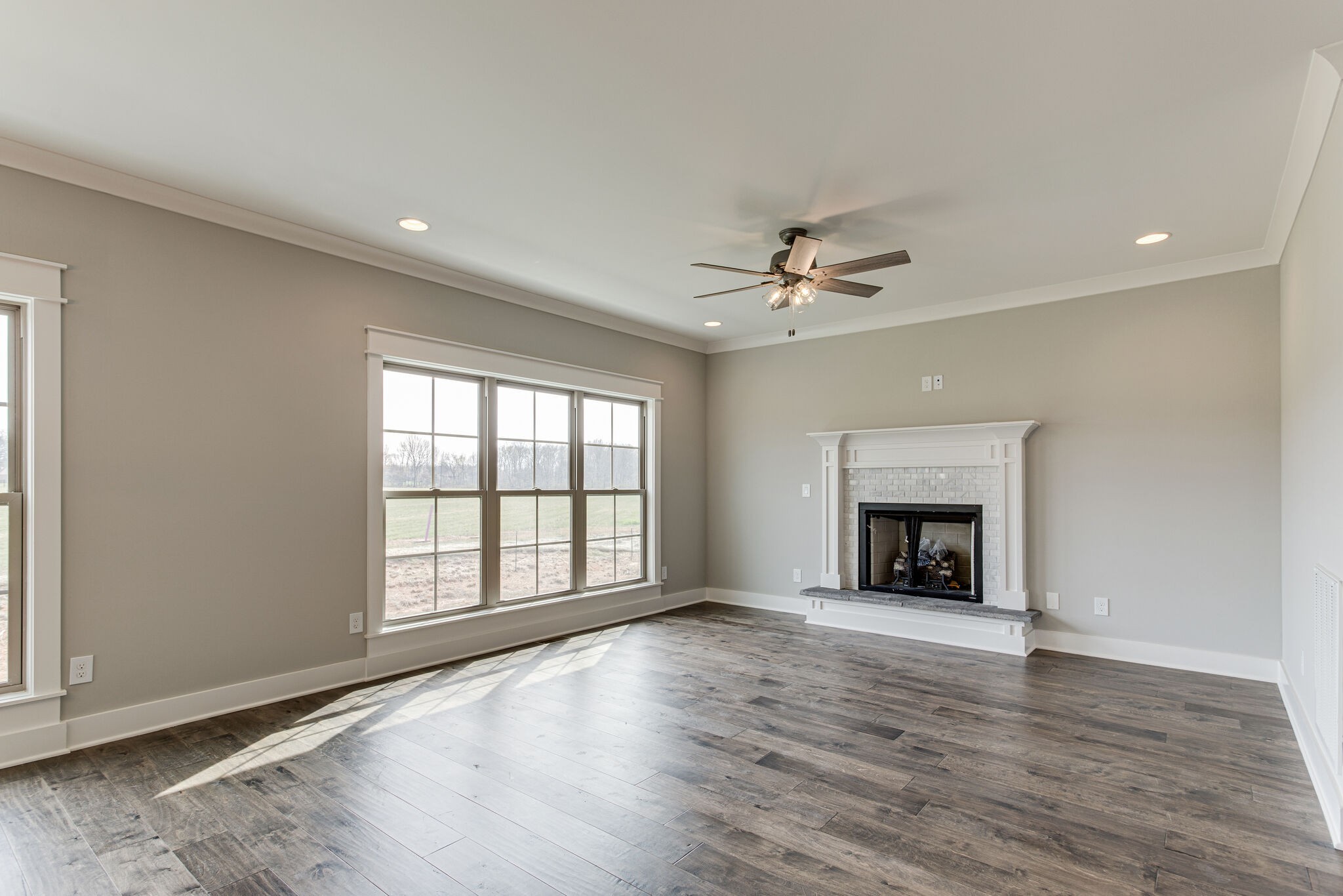 2617 Holly Spring Drive Murfreesboro, TN 37128 - Photo 33 of 50 an empty room with windows fireplace and a sink