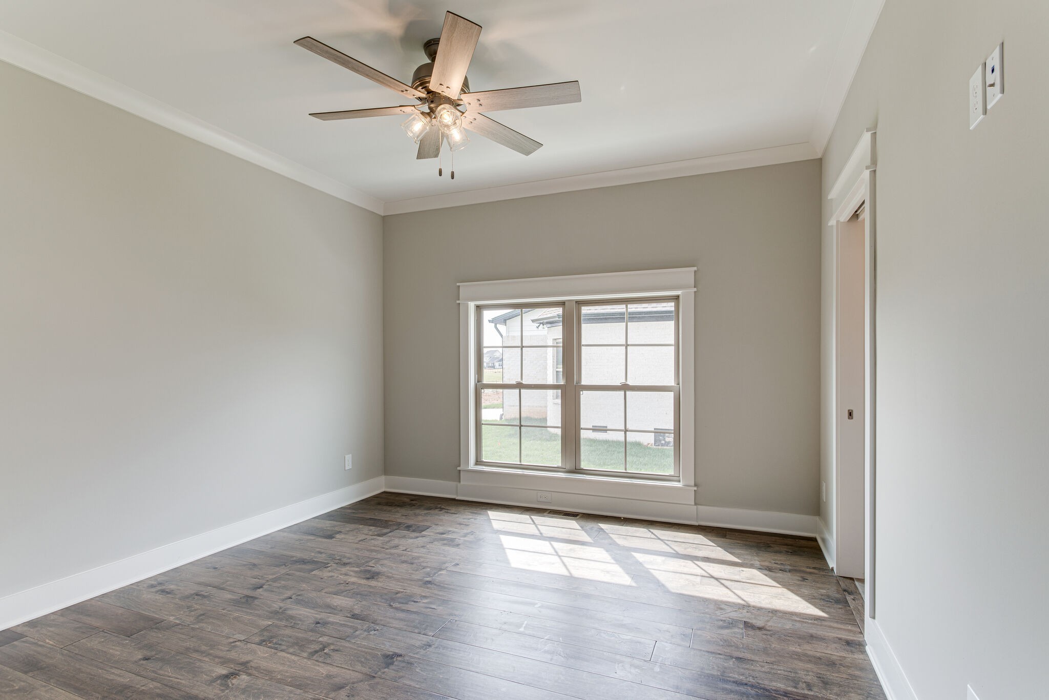 2617 Holly Spring Drive Murfreesboro, TN 37128 - Photo 35 of 50 an empty room with wooden floor chandelier fan and windows
