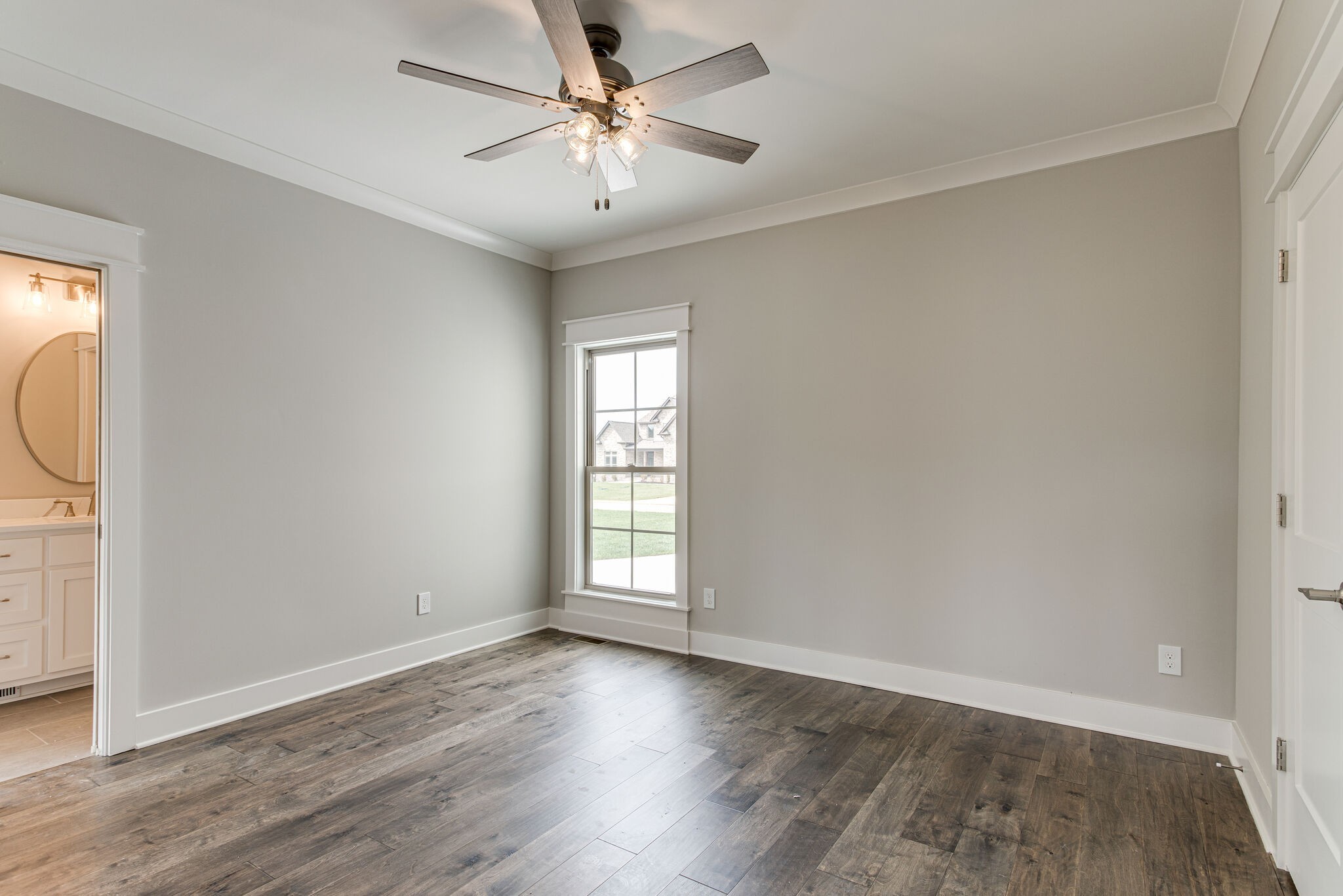 2617 Holly Spring Drive Murfreesboro, TN 37128 - Photo 39 of 50 an empty room with wooden floor fan and windows