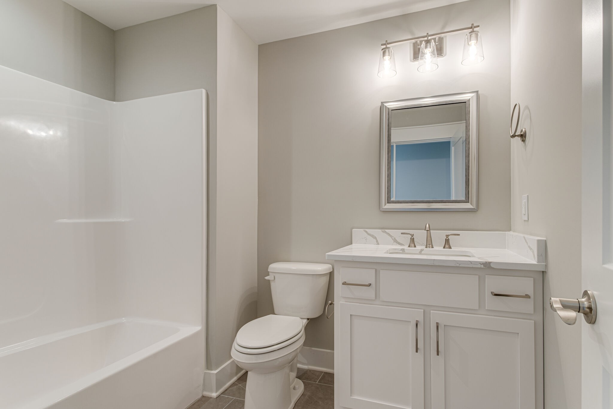2617 Holly Spring Drive Murfreesboro, TN 37128 - Photo 43 of 50 a bathroom with a toilet a sink a mirror and bathtub