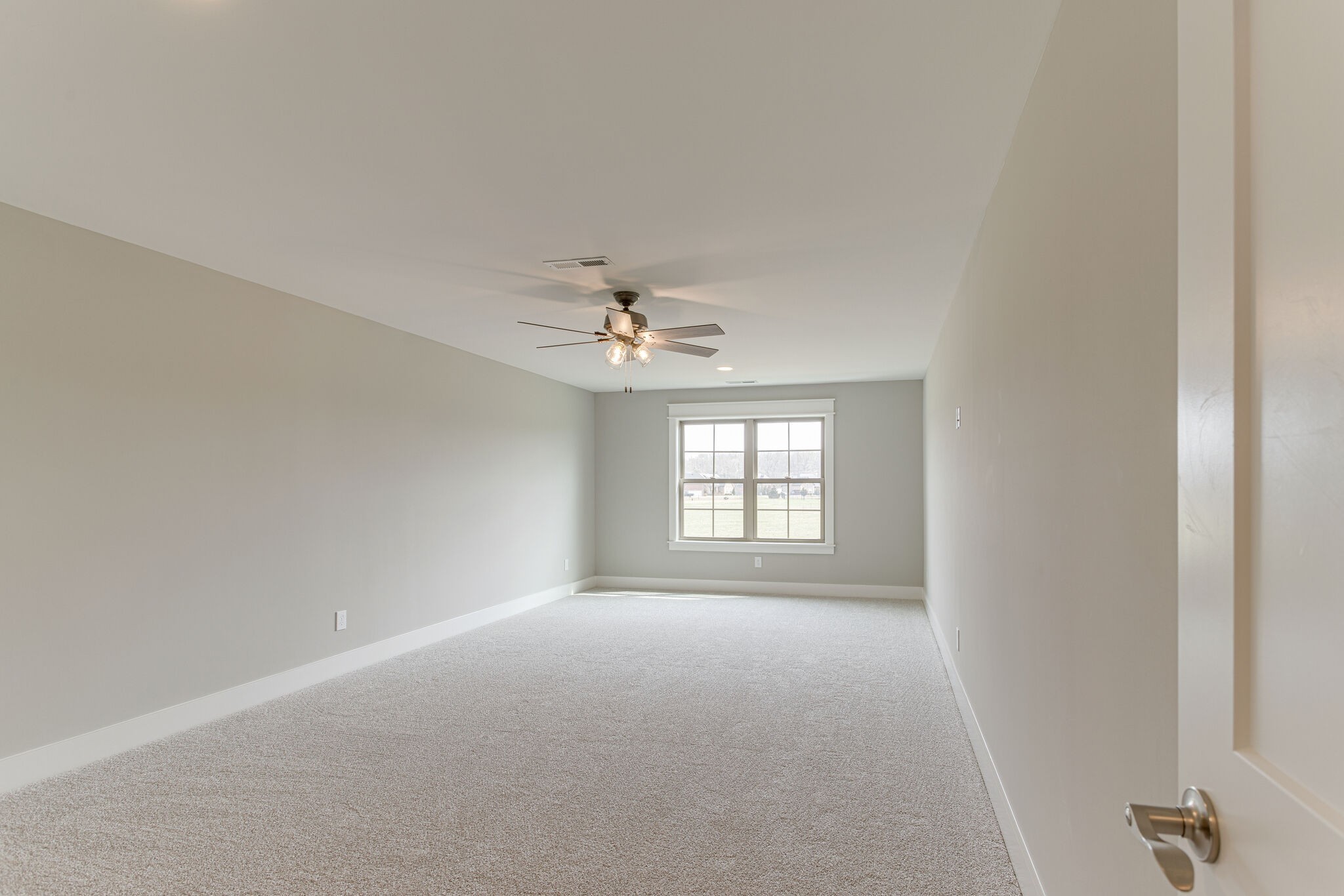 2617 Holly Spring Drive Murfreesboro, TN 37128 - Photo 44 of 50 an empty room with windows and ceiling fan view