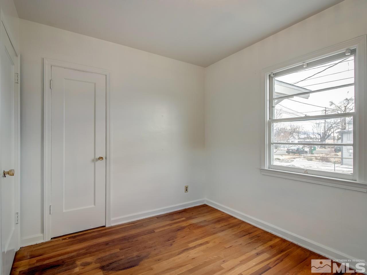 1215 Wheeler Avenue Reno, NV 89502 - Photo 18 of 25 a view of an empty room with wooden floor and a window