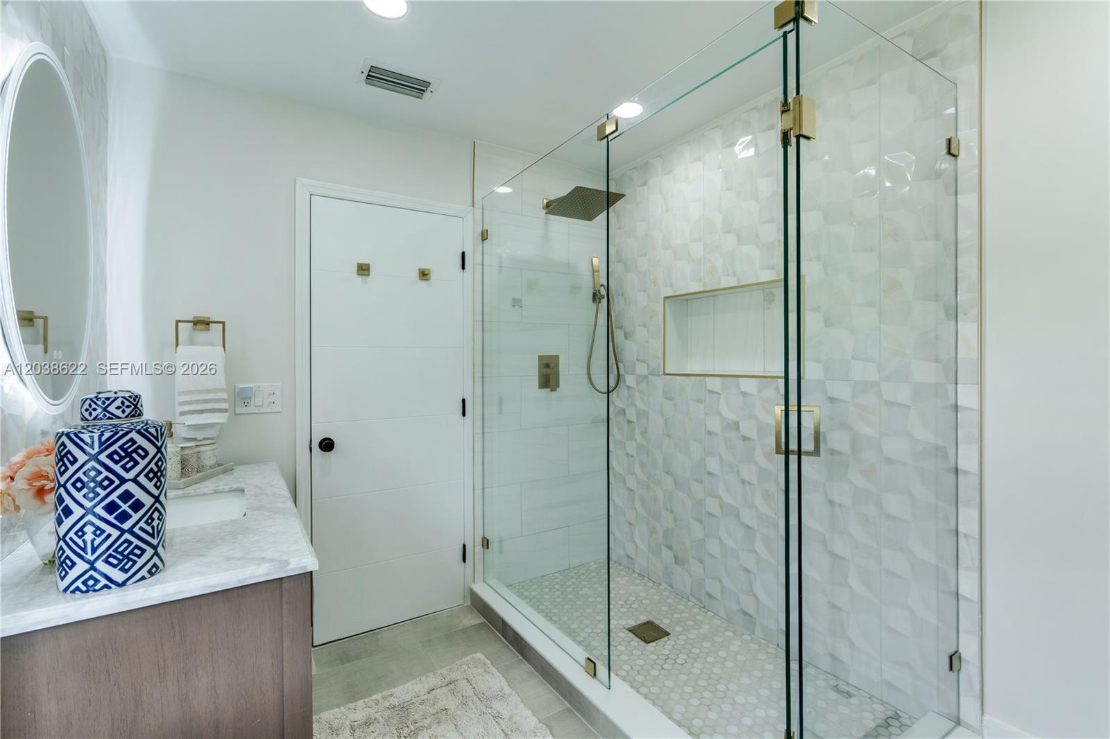 14830 Southwest 149th Street Miami, FL 33196 - Photo 16 of 43 a bathroom with a shower and a sink