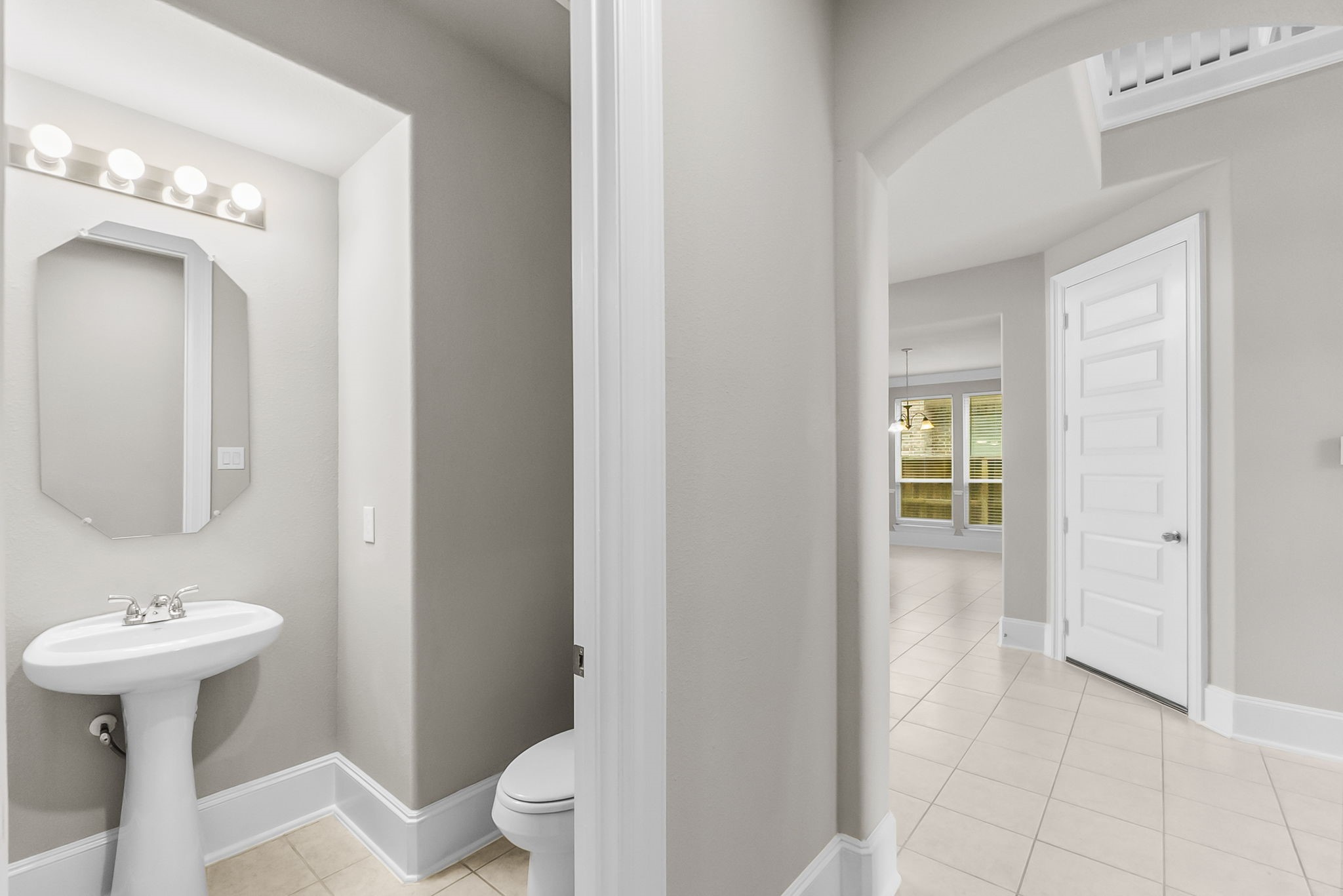 8710 Burdekin Road Magnolia, TX 77354 - Photo 27 of 49 a bathroom with a sink a toilet and a mirror