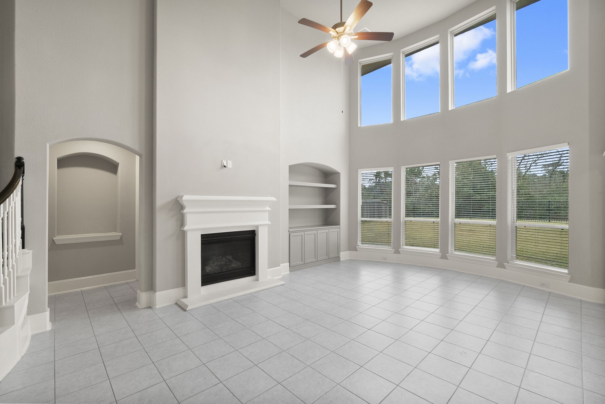 8710 Burdekin Road Magnolia, TX 77354 - Photo 10 of 49 a view of an empty room with a fireplace and a window