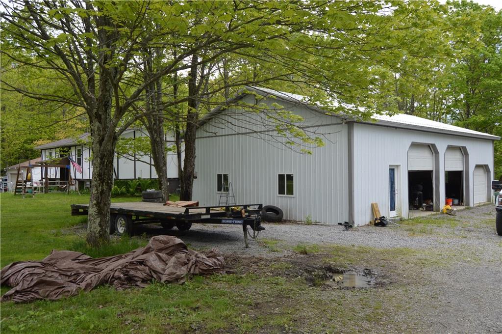 122 Arrowhead Road Emlenton, PA 16373 - Photo 18 of 21 a backyard of a house with table and chairs