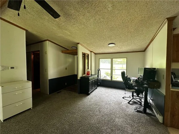 a bedroom with furniture and a window