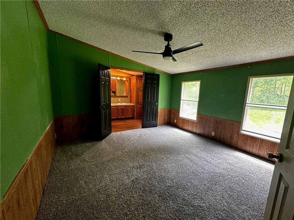 122 Arrowhead Road Emlenton, PA 16373 - Photo 6 of 21 a view of a livingroom with a fireplace and a window