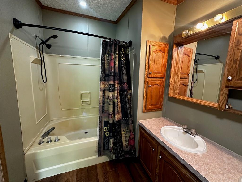 122 Arrowhead Road Emlenton, PA 16373 - Photo 8 of 21 a bathroom with a tub sink a mirror a shower and vanity