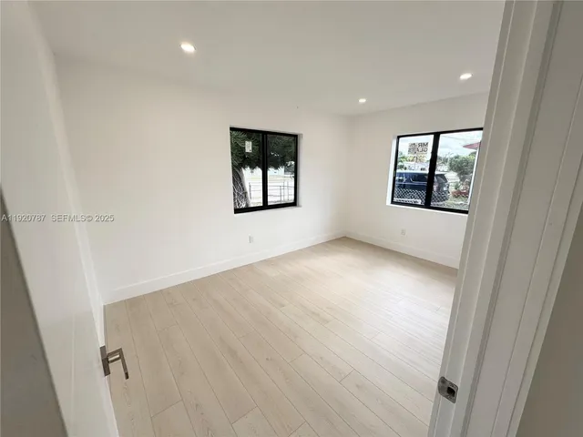 en empty room with windows