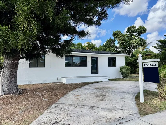 a house with trees in the background