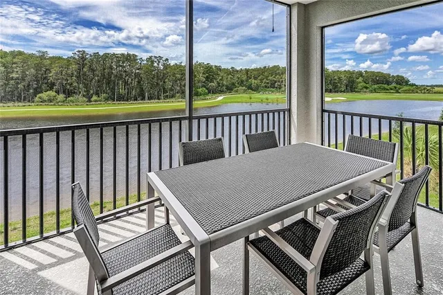 a view of a balcony with wooden floor and outdoor seating