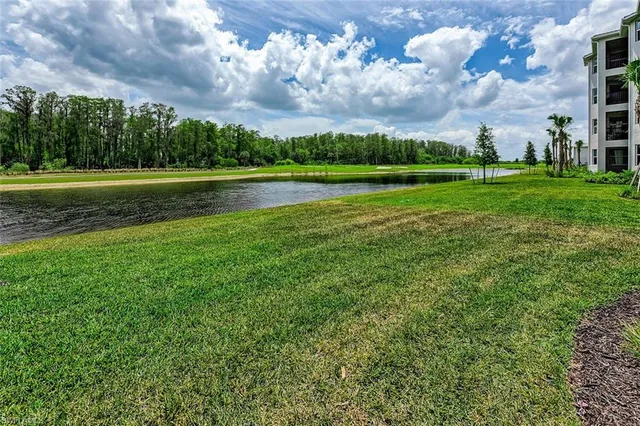 a view of a golf course with a lake view