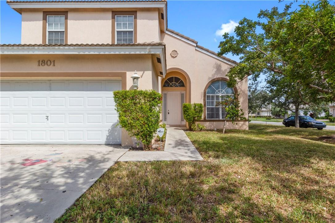 1801 Northwest 3rd Street Pompano Beach, FL 33069 - Photo 1 of 25 a front view of a house with garden