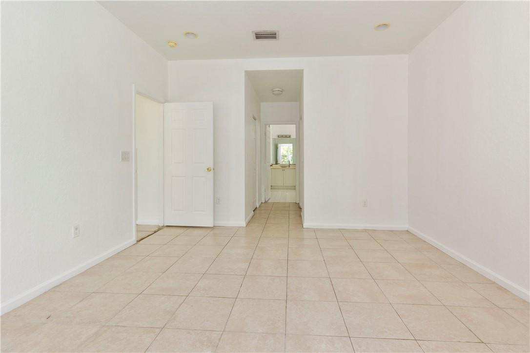 1801 Northwest 3rd Street Pompano Beach, FL 33069 - Photo 13 of 25 an empty room with entrance and mirror
