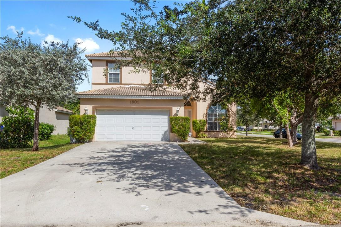1801 Northwest 3rd Street Pompano Beach, FL 33069 - Photo 2 of 25 a front view of a house with a garden
