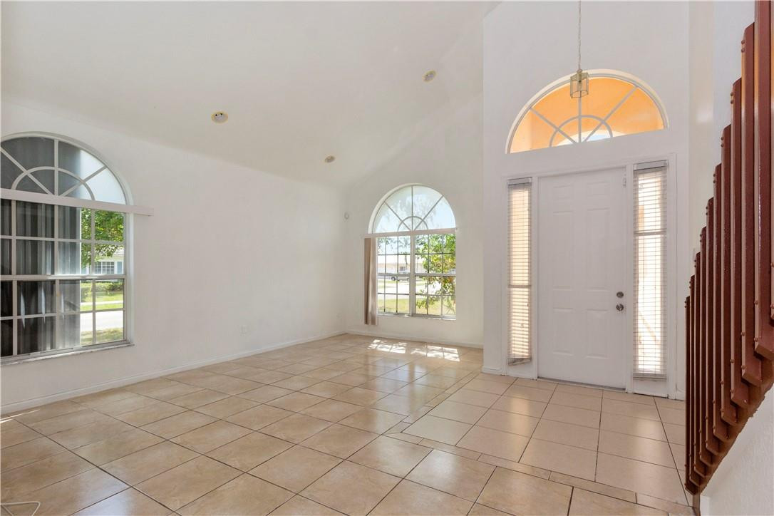 1801 Northwest 3rd Street Pompano Beach, FL 33069 - Photo 5 of 25 an empty room with windows