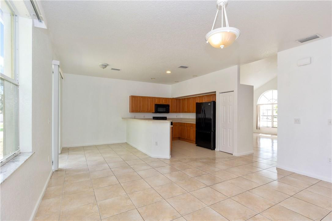 1801 Northwest 3rd Street Pompano Beach, FL 33069 - Photo 9 of 25 a view of a kitchen with a sink and dishwasher cabinets