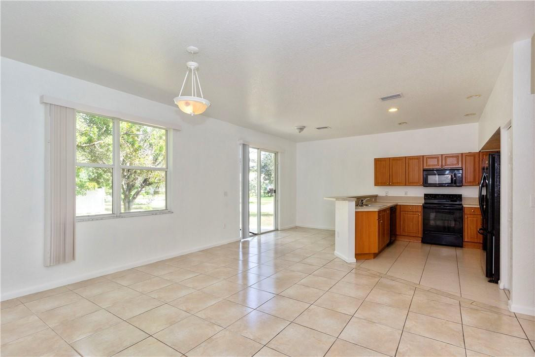 1801 Northwest 3rd Street Pompano Beach, FL 33069 - Photo 10 of 25 a view of a kitchen with furniture and window