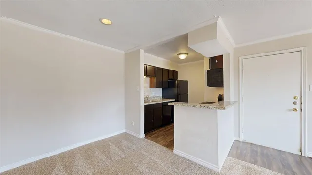 a kitchen with a refrigerator a stove top oven a sink and dishwasher