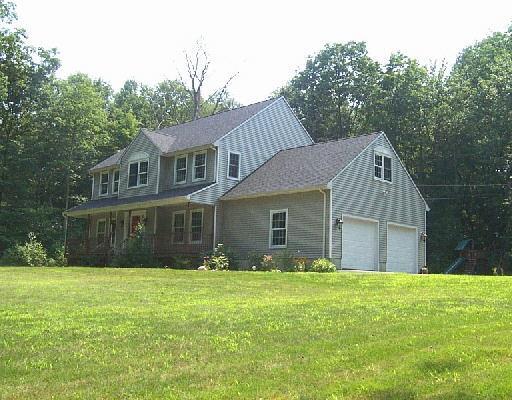 53 Newgate Road Oxford, CT 06478 - Photo 1 of 1 a front view of house with yard and green space