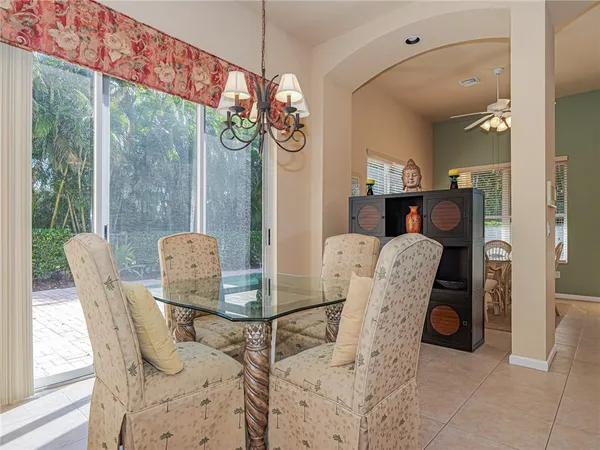a view of a dining room with furniture window and outside view