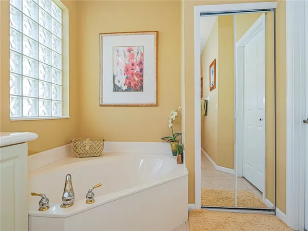 a bathroom with a tub and a shower