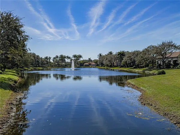 a view of a lake with houses in the background