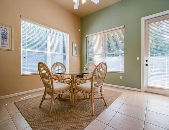 a view of a dining room with furniture and a window