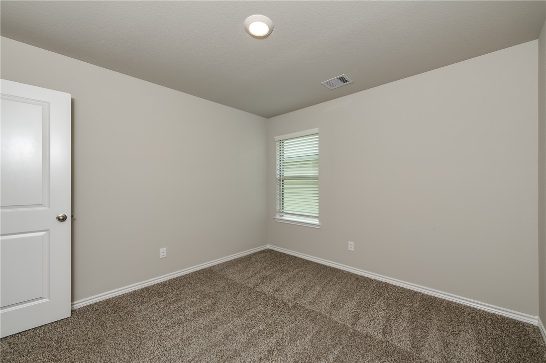2166 Chief Street Bryan, TX 77807 - Photo 11 of 18 an empty room with windows
