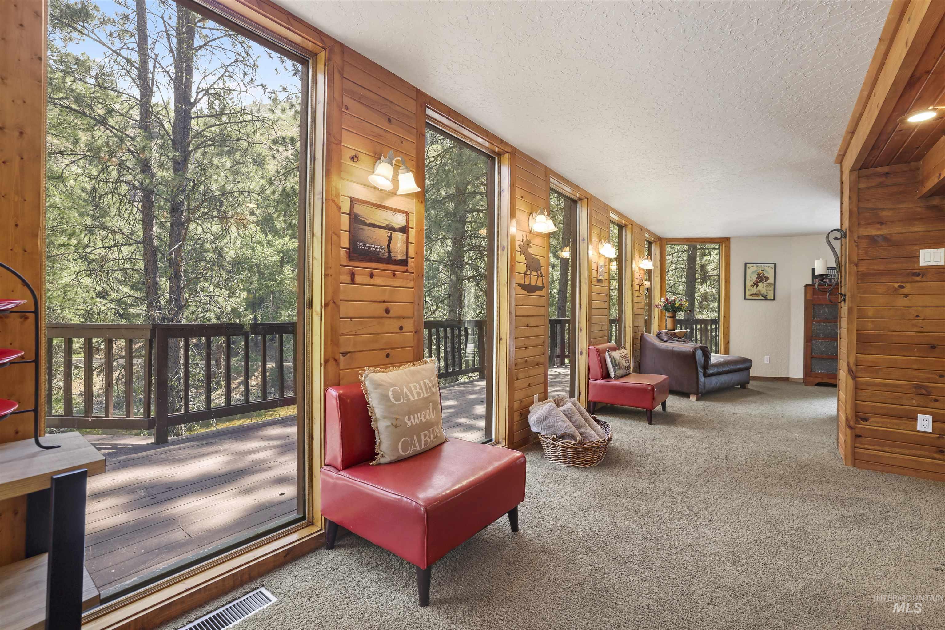 224 Dakota Road Mountain Home, ID 83647 - Photo 7 of 50 Expansive window wall with multiple full-length glass panels