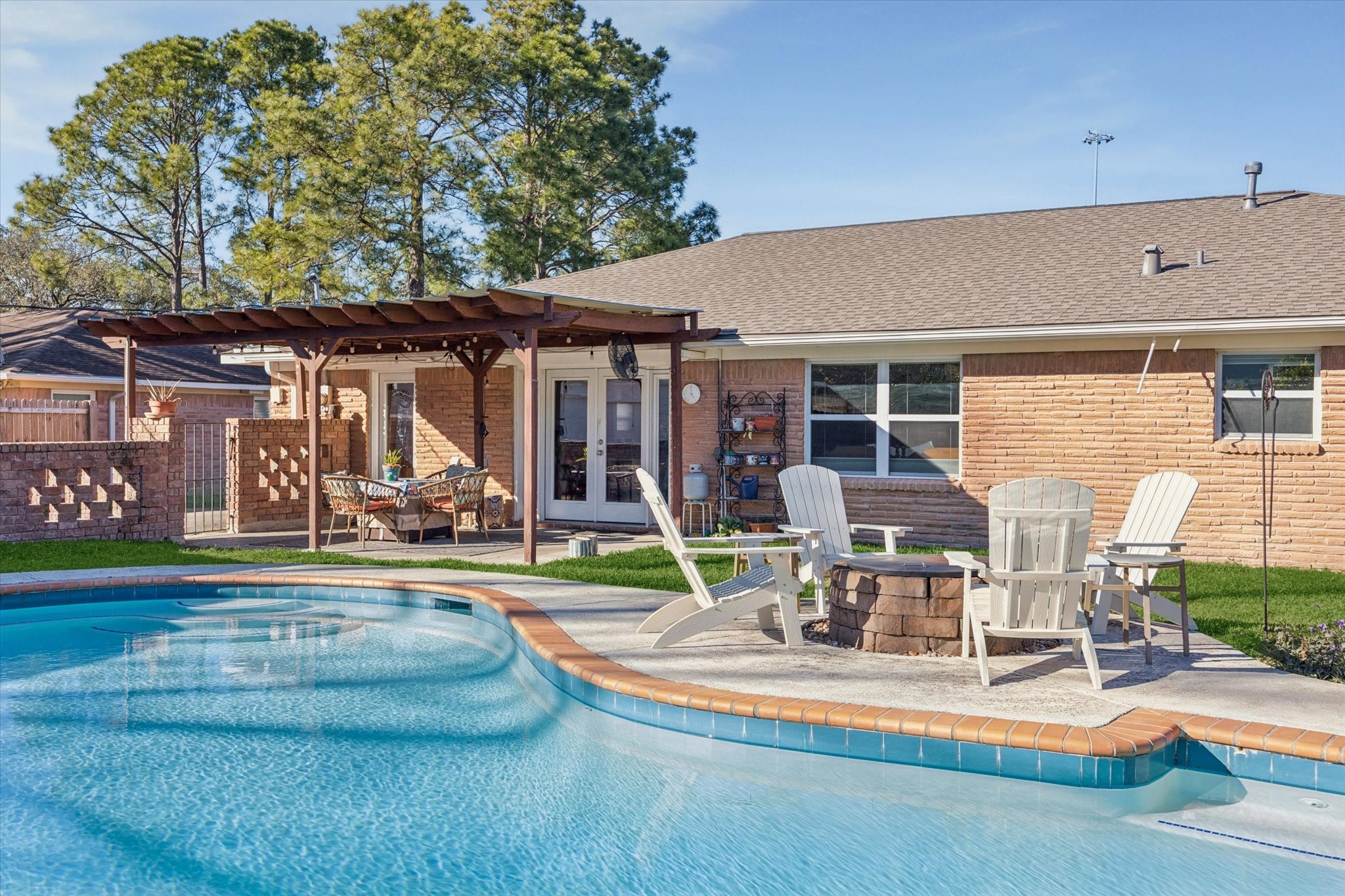 4423 Lemac Drive Houston, TX 77096 - Photo 28 of 30 a view of a patio with table and chairs potted plants and large tree