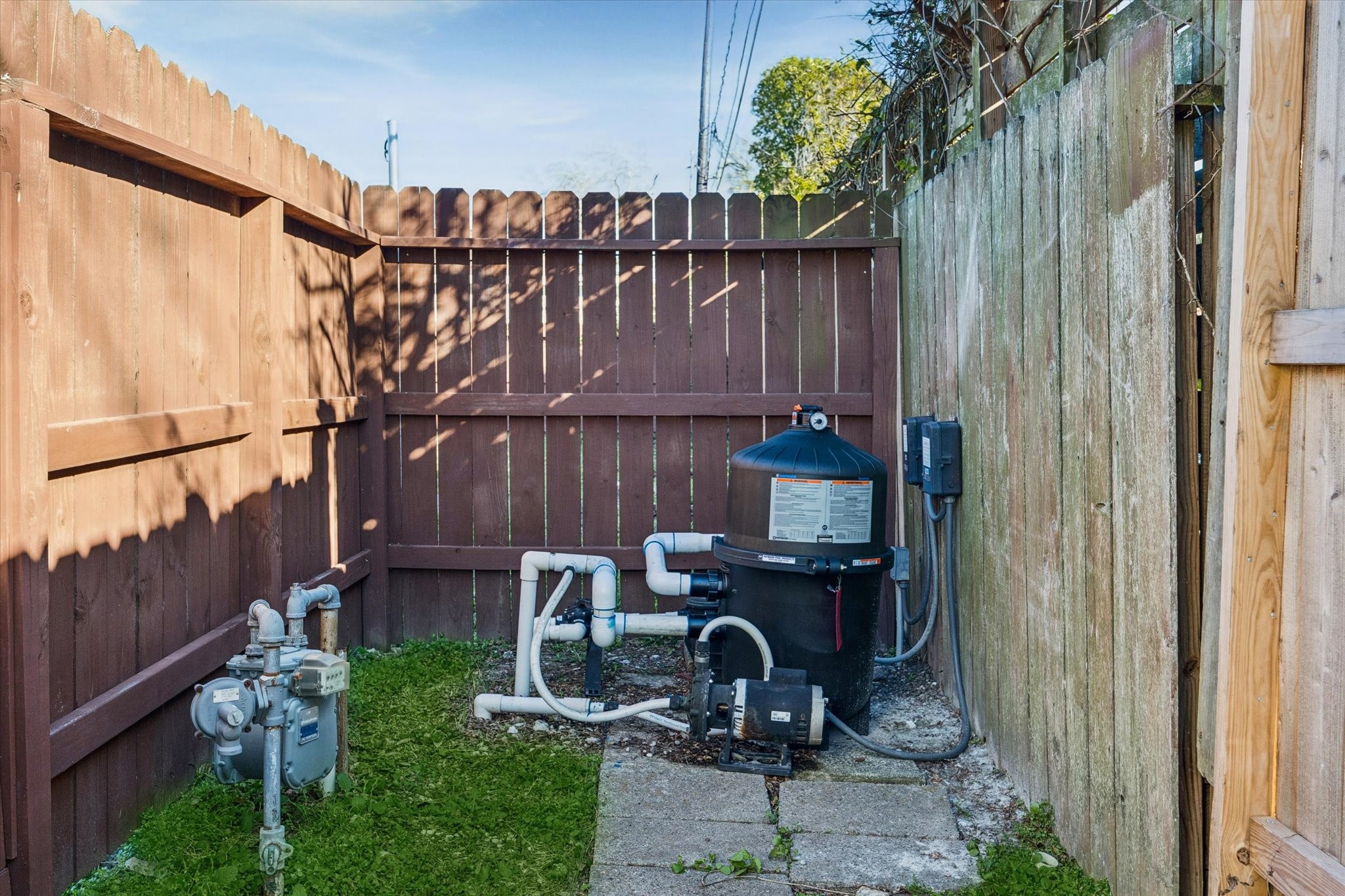4423 Lemac Drive Houston, TX 77096 - Photo 29 of 30 a view of a backyard with wooden fence and a bench