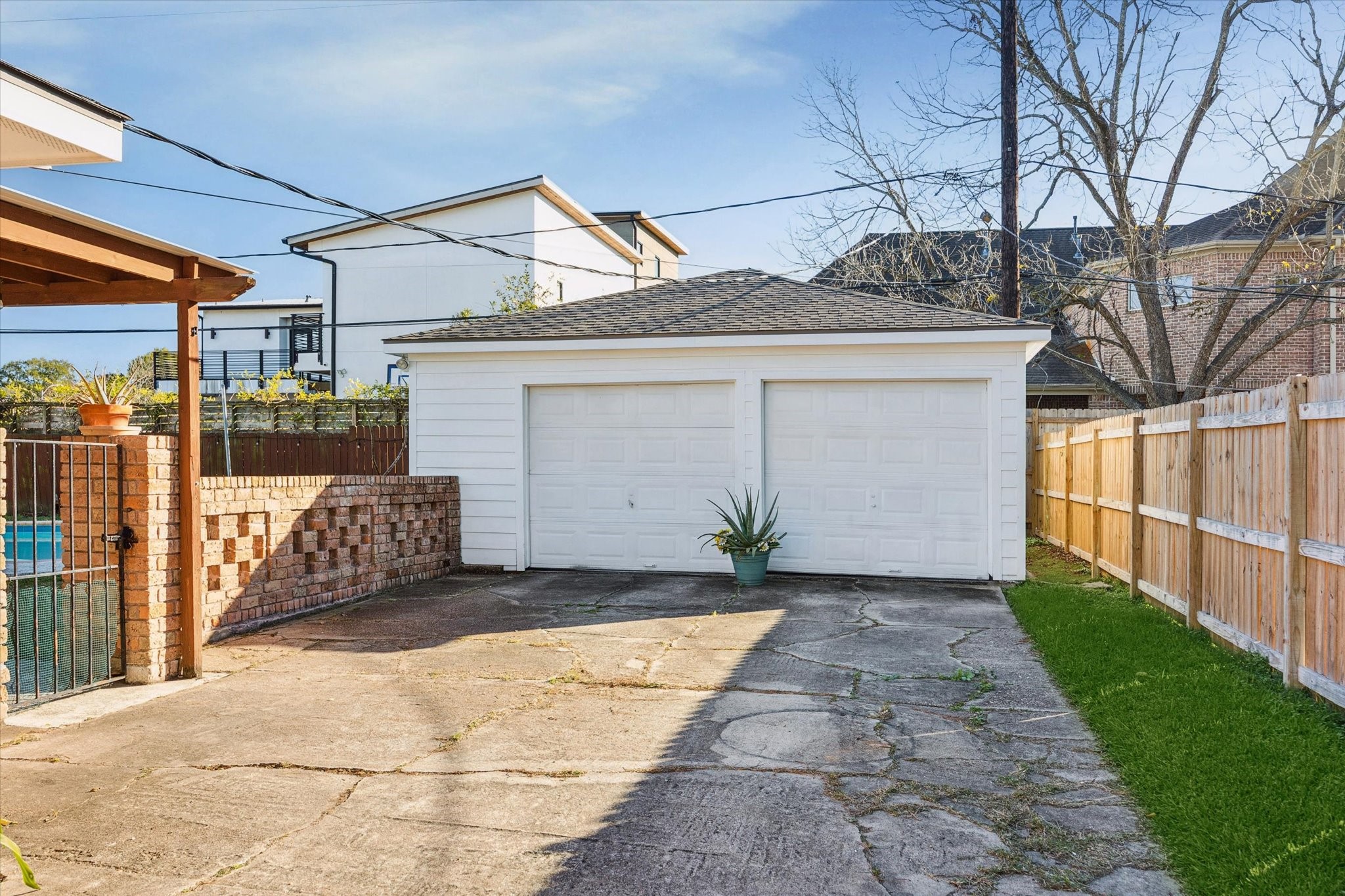 4423 Lemac Drive Houston, TX 77096 - Photo 30 of 30 a front view of a house with a yard and garage