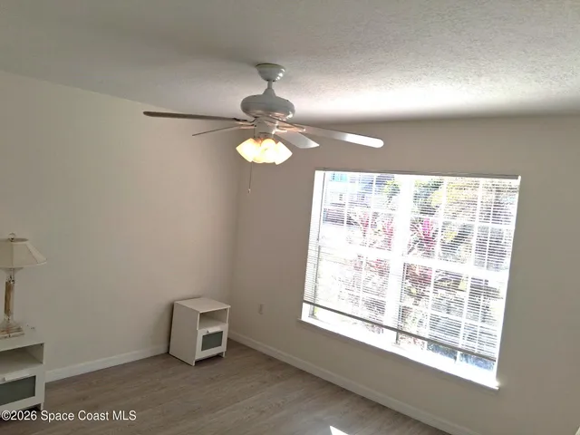 a view of a wooden deck and a yard
