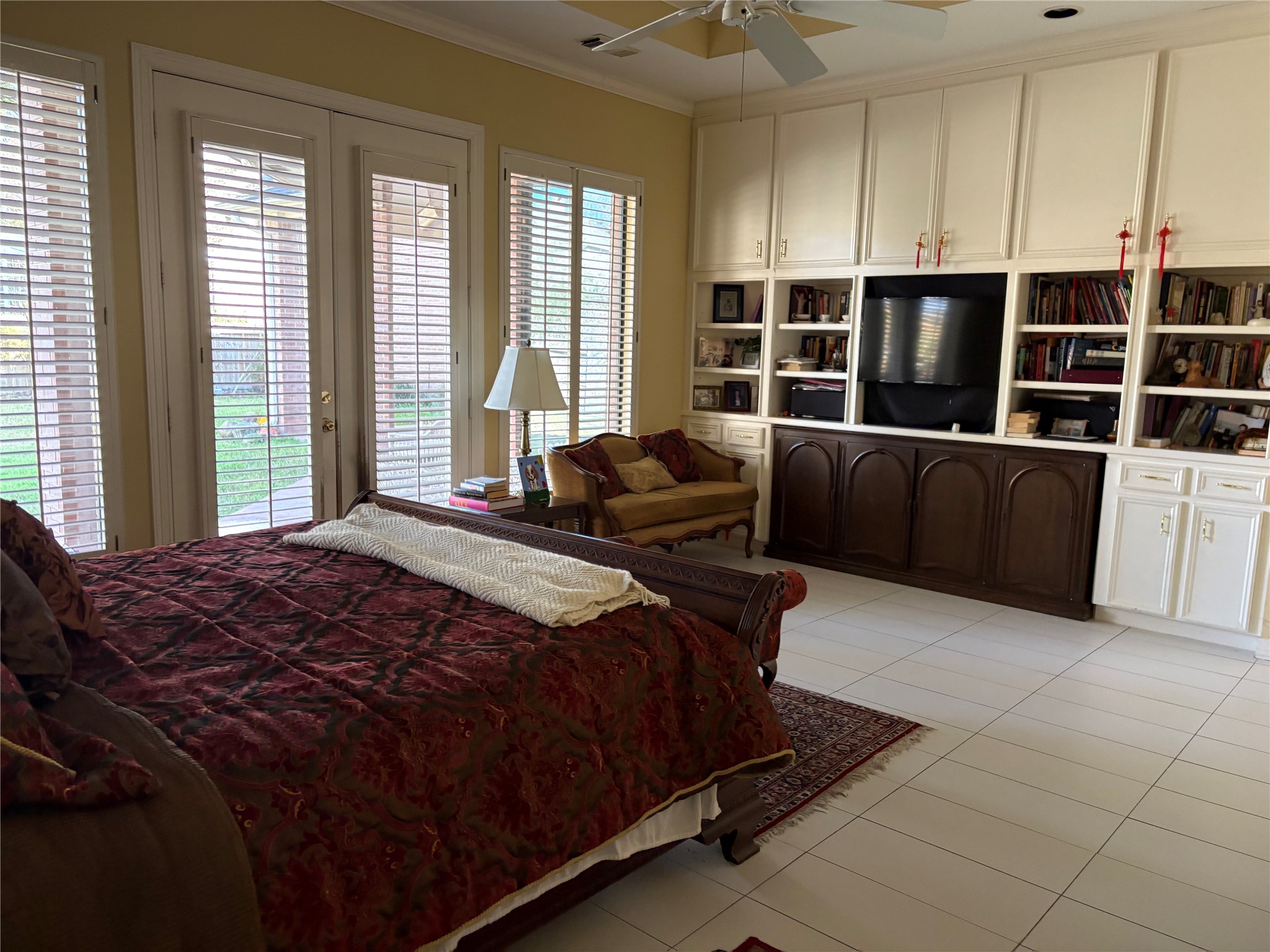 24602 West Kingscrest Circle Spring, TX 77389 - Photo 12 of 20 a bedroom with a bed and glass window