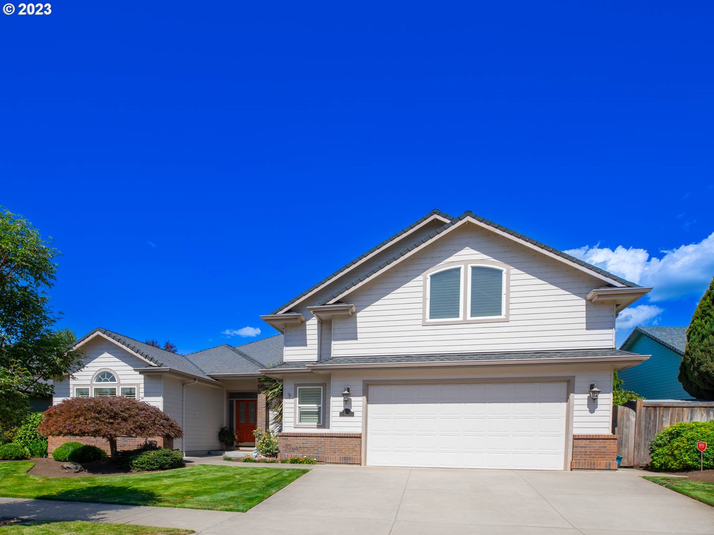836 Old Orchard Lane Springfield, OR 97477 - Photo 2 of 29 a front view of a house with a garden and yard