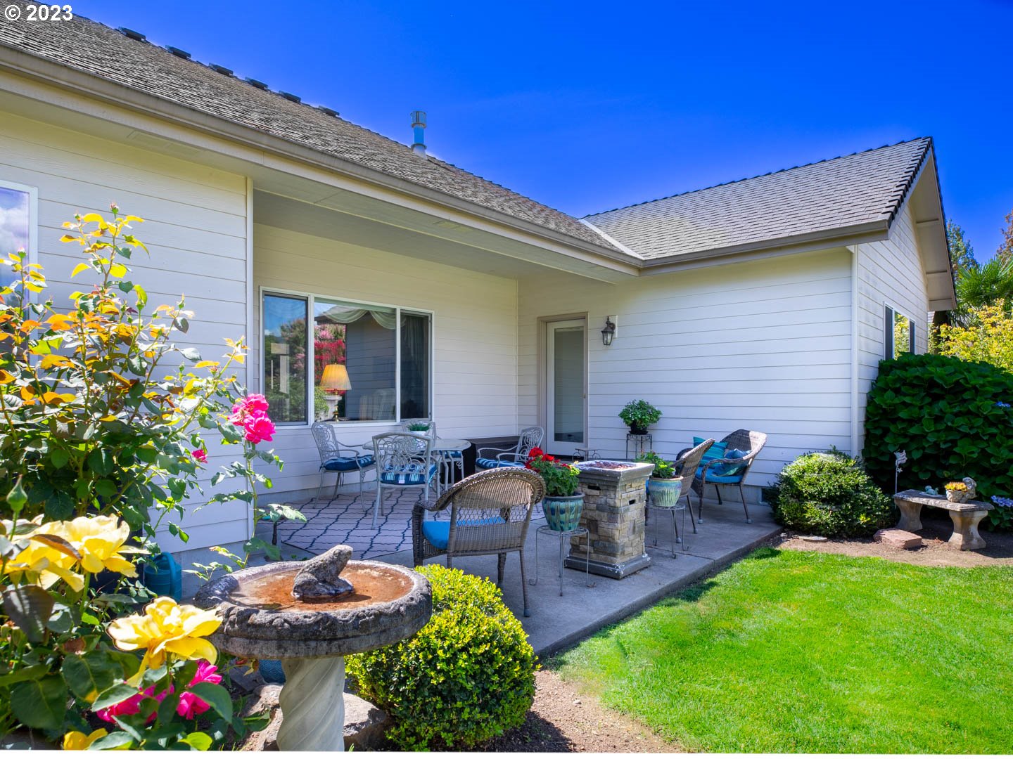 836 Old Orchard Lane Springfield, OR 97477 - Photo 22 of 29 a front view of a house with an outdoor seating