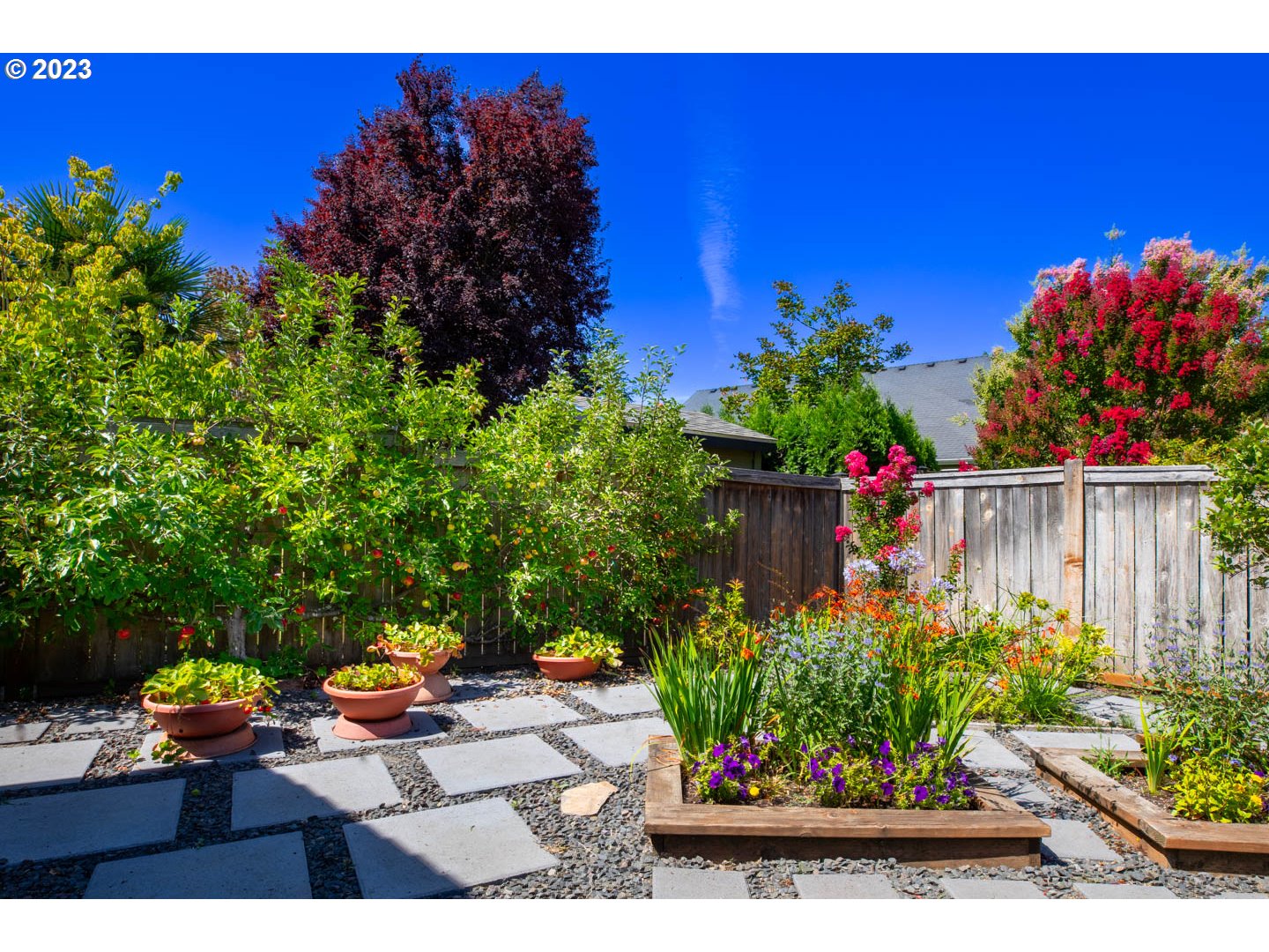 836 Old Orchard Lane Springfield, OR 97477 - Photo 28 of 29 a view of a bench in bunch of flower