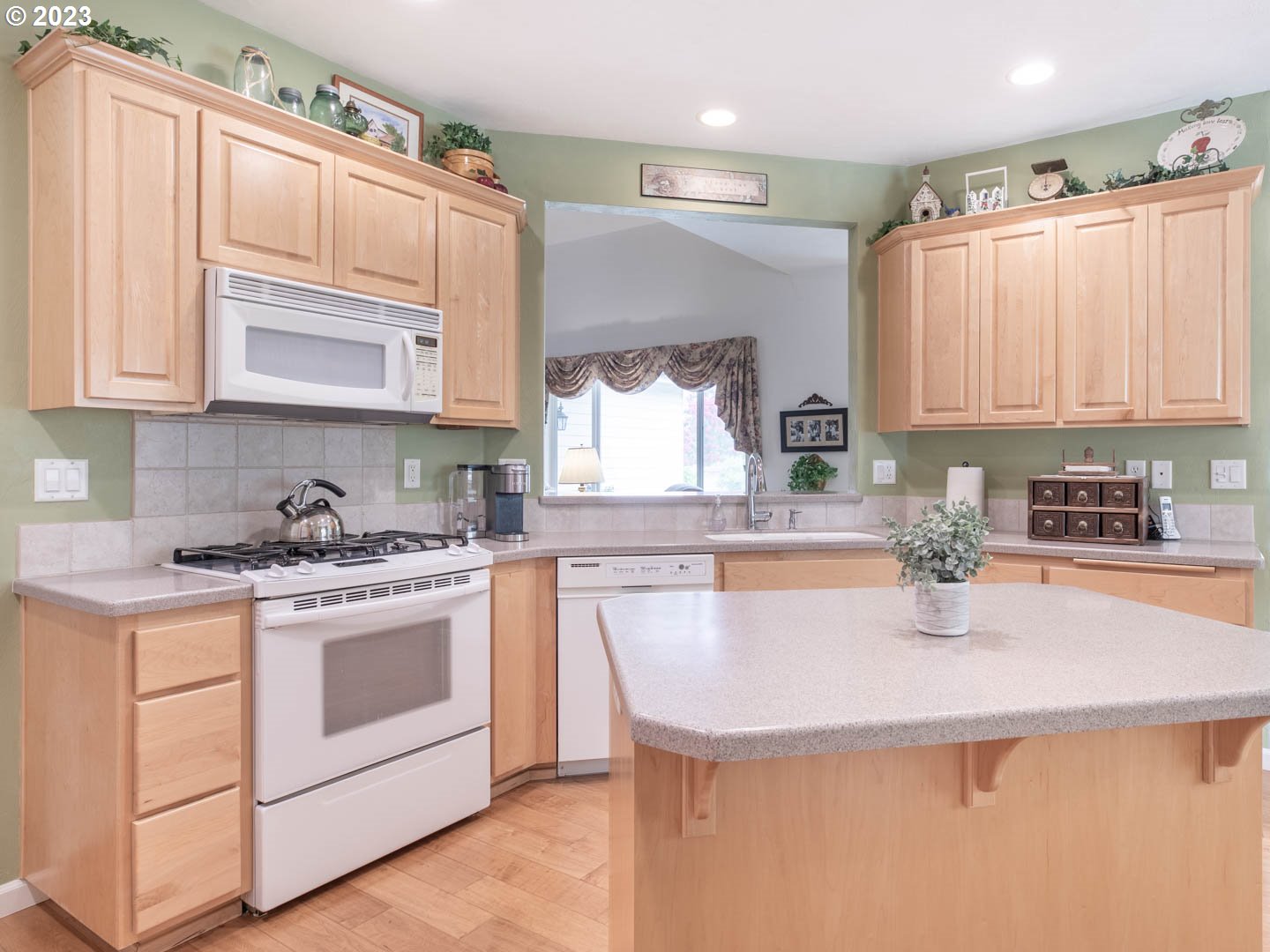 836 Old Orchard Lane Springfield, OR 97477 - Photo 8 of 29 a kitchen with stainless steel appliances granite countertop a sink stove and cabinets